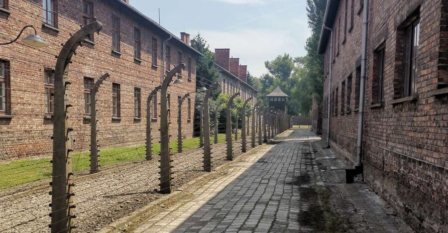 From Krakow: Auschwitz-Birkenau Camp Complex Guided Day Trip - Auschwitz I: from military barracks to an entry that stops you cold