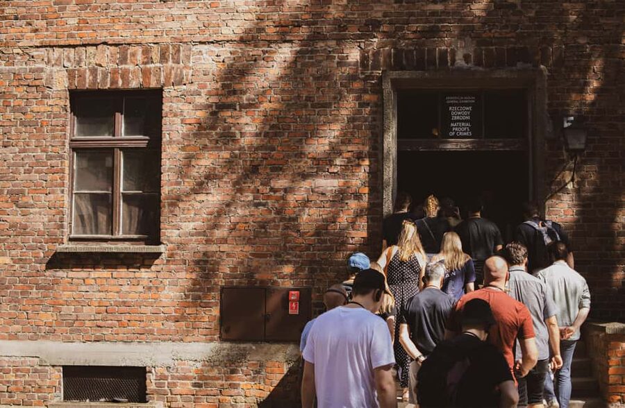 From Krakow: Auschwitz-Birkenau Live Guided Tour & Pickup - Inside Auschwitz I: The Gate, the Barracks, and the Museum’s Pace