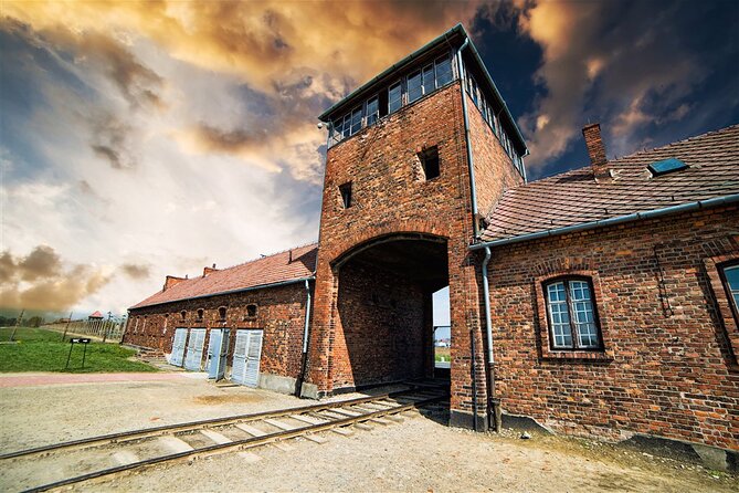 From Krakow: Auschwitz-Birkenau Trip with Transport - Auschwitz I: walking in through the gate and hearing the story clearly