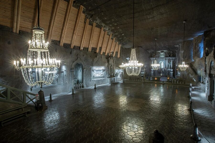 From Krakow: Salt Mine Guided Tour with hotel pick up - Inside the Mine: 9 Levels, Sculptures, Chapels, and an Underground Lake