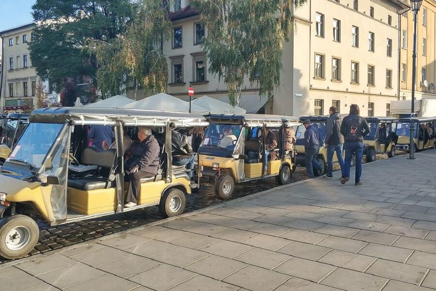 Krakow: Kazimierz by Golf Cart and Schindler's Factory Tour - Podgórze and the former ghetto: walls, chairs, and the pharmacy