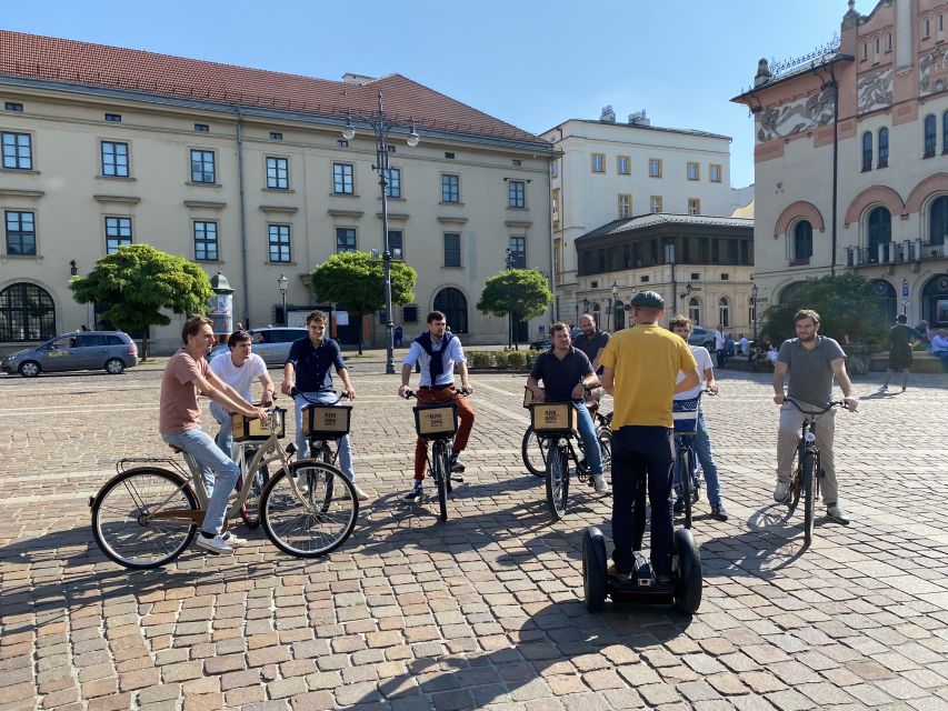 Krakow: Old Town Bike Tour with a Guide - Main Square stops: more than a pretty landmark