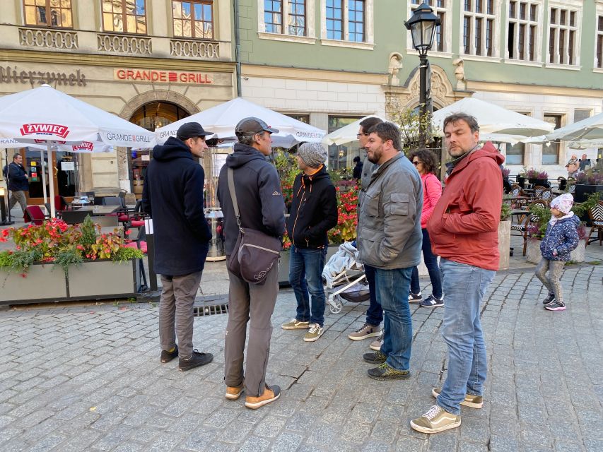 Krakow: Old Town Highlights Walking Tour - Old Town Strolls: Old District Energy with Real Context